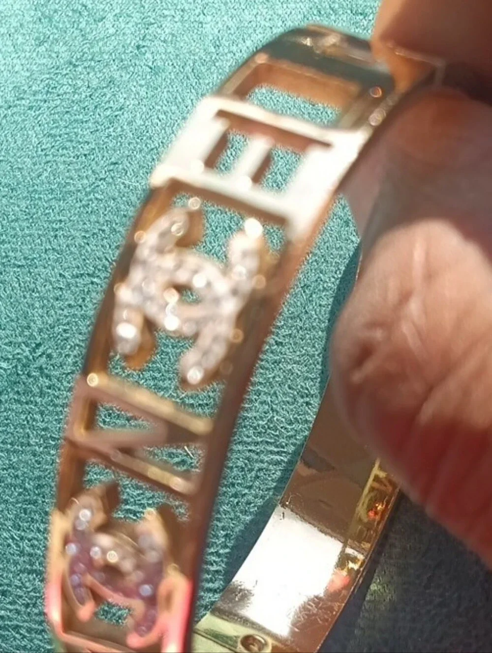 CHANEL Gold Cut-Out Logo Bangle